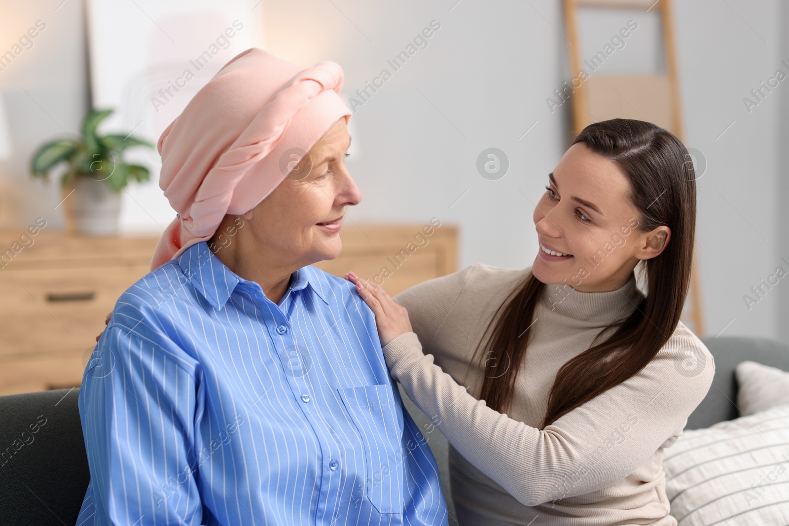 Photo of Woman with cancer and her daughter at home