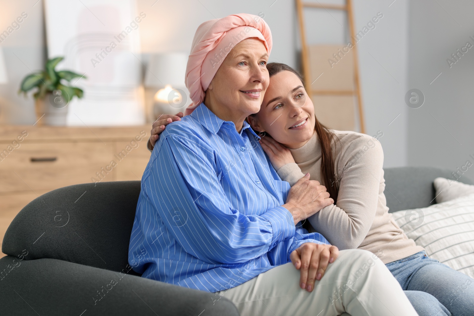 Photo of Woman with cancer and her daughter at home