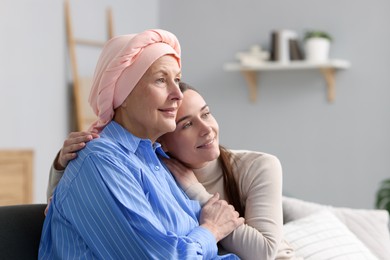 Photo of Woman with cancer and her daughter at home