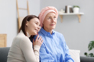 Photo of Woman with cancer and her daughter at home