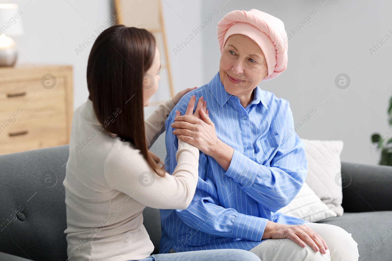 Photo of Woman with cancer and her daughter at home