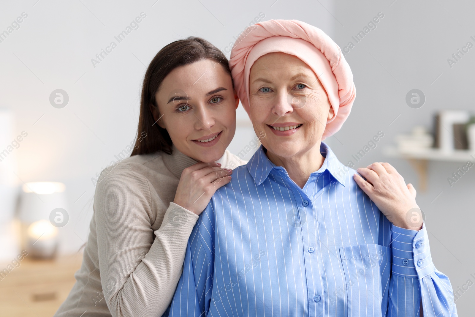 Photo of Woman with cancer and her daughter at home