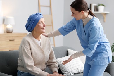 Photo of Nurse helping woman with cancer at home