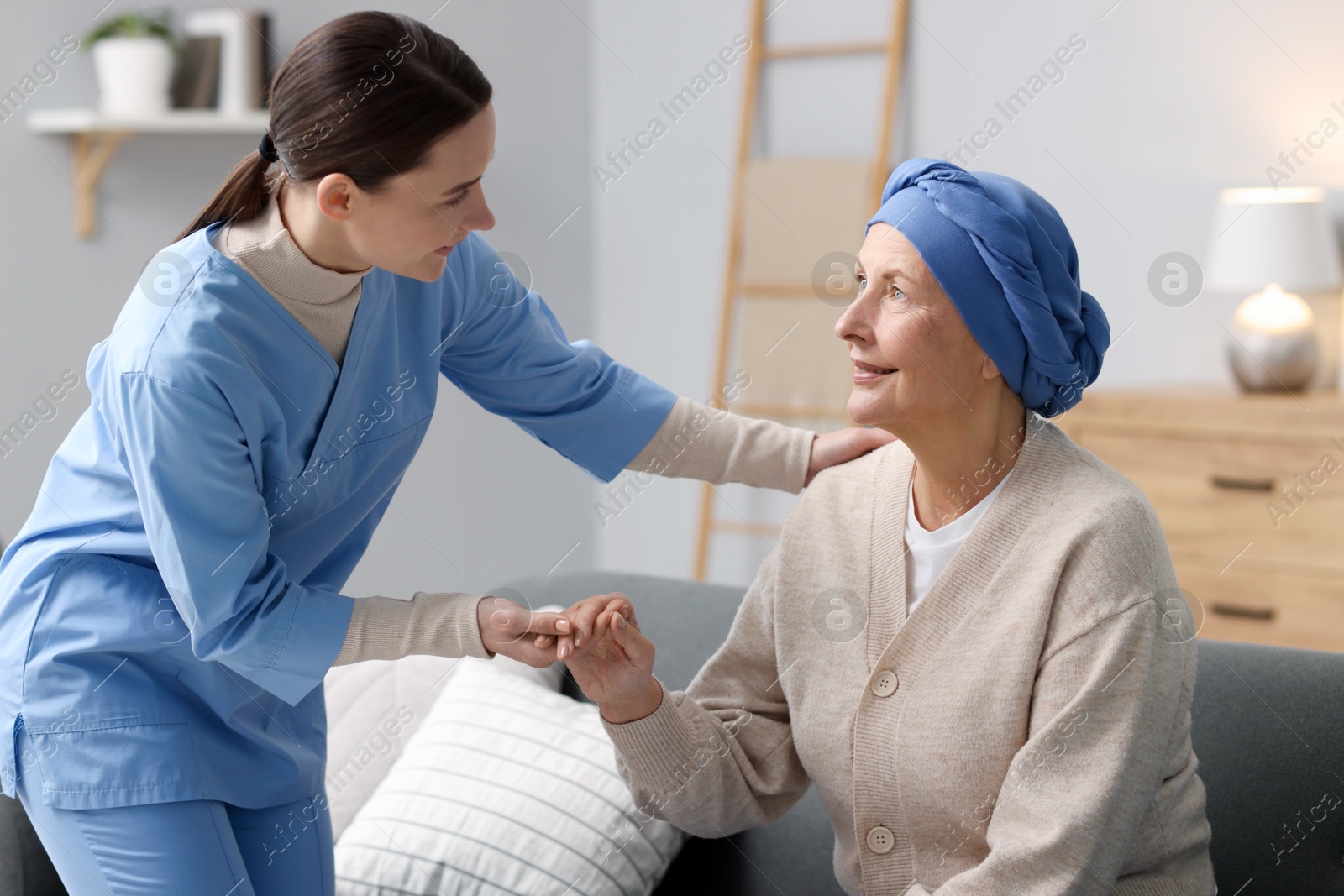 Photo of Nurse helping woman with cancer at home