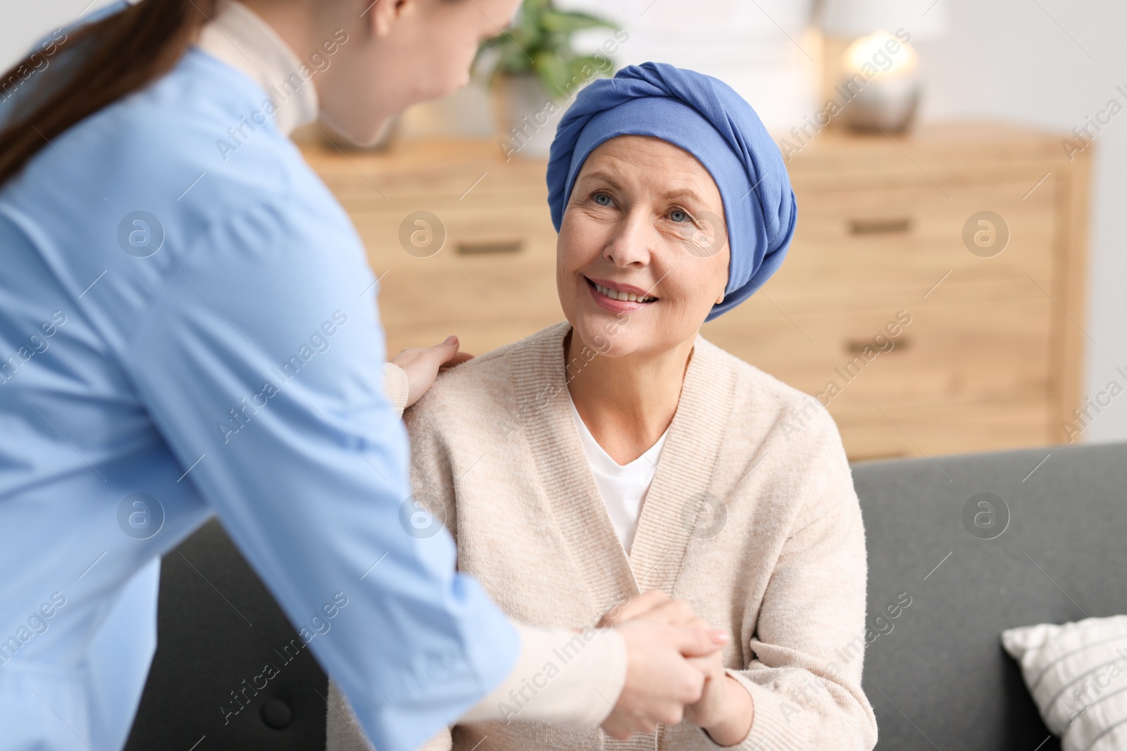 Photo of Nurse helping woman with cancer at home