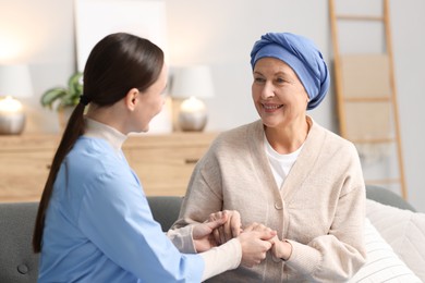 Photo of Nurse supporting woman with cancer at home