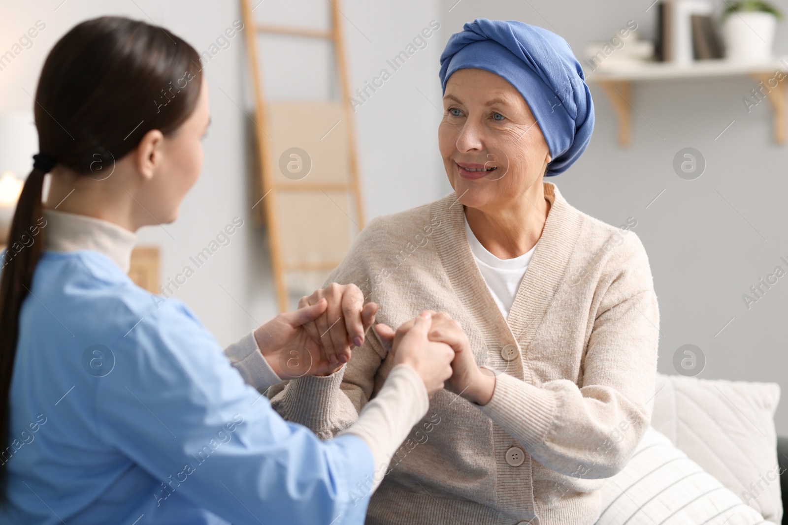 Photo of Nurse supporting woman with cancer at home