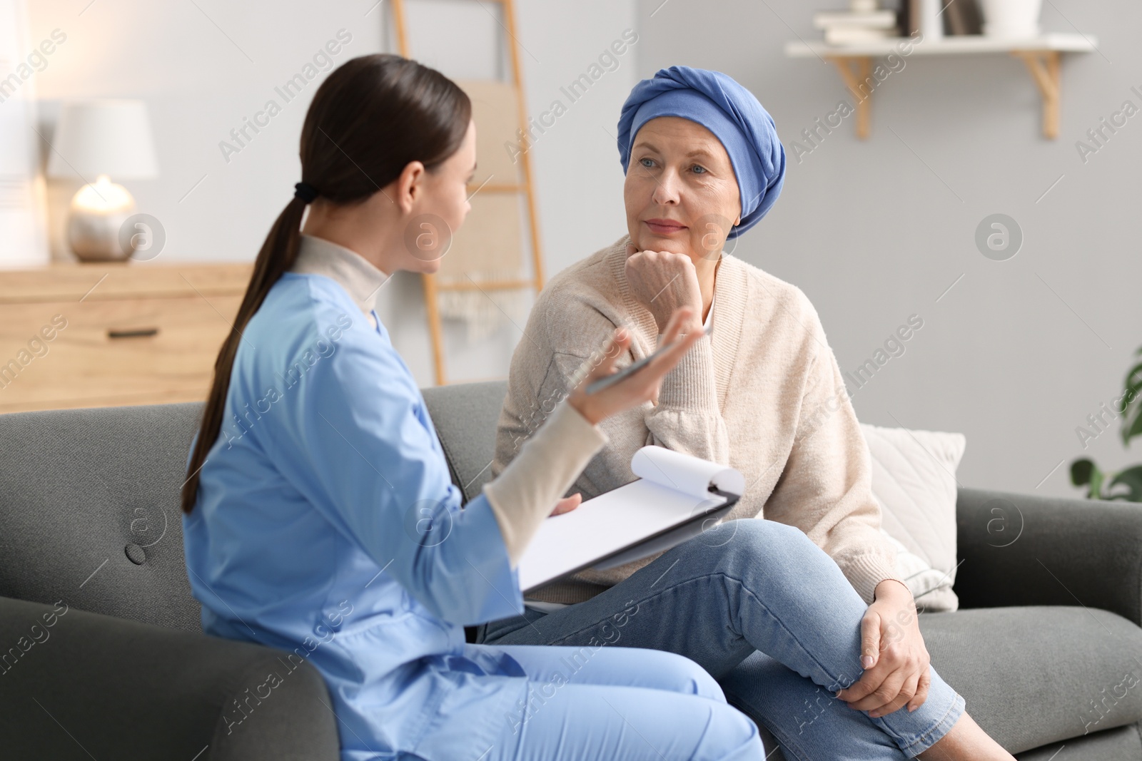 Photo of Woman with cancer and nurse at home