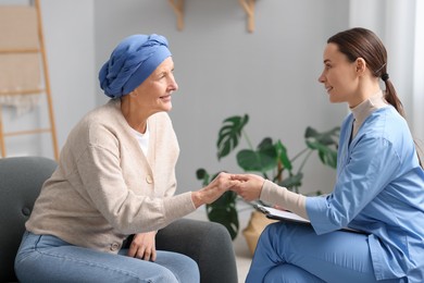 Photo of Nurse supporting woman with cancer at home