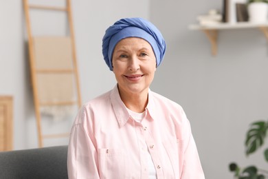 Photo of Portrait of senior woman with cancer at home