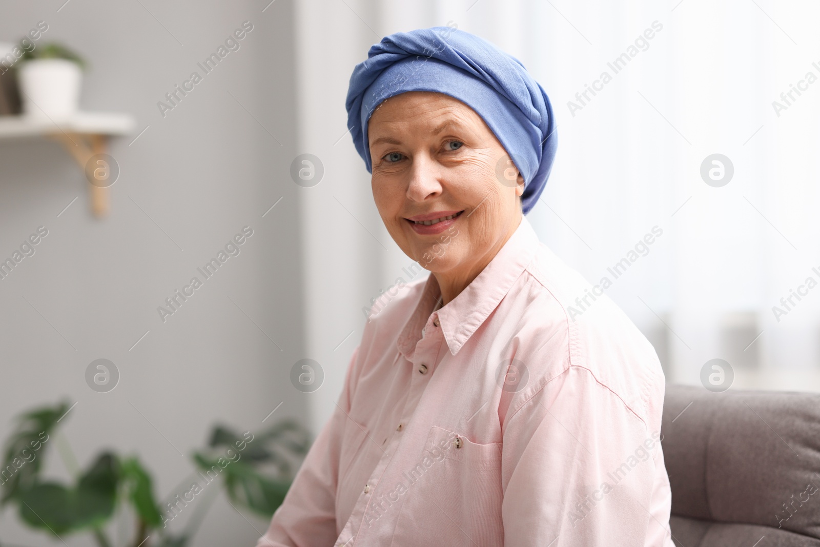 Photo of Portrait of senior woman with cancer at home