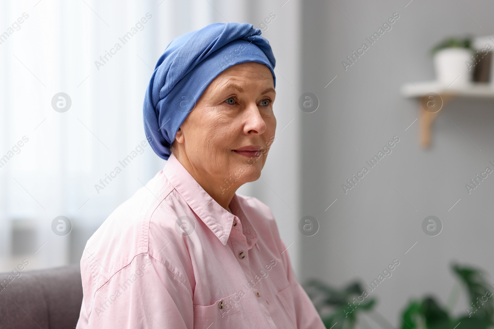 Photo of Portrait of senior woman with cancer at home