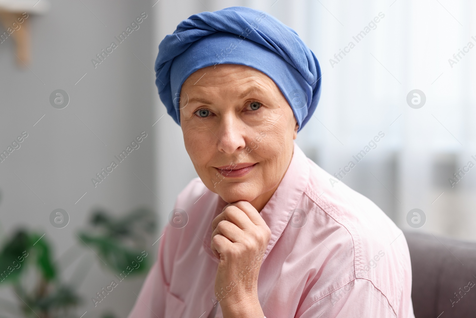 Photo of Portrait of senior woman with cancer at home