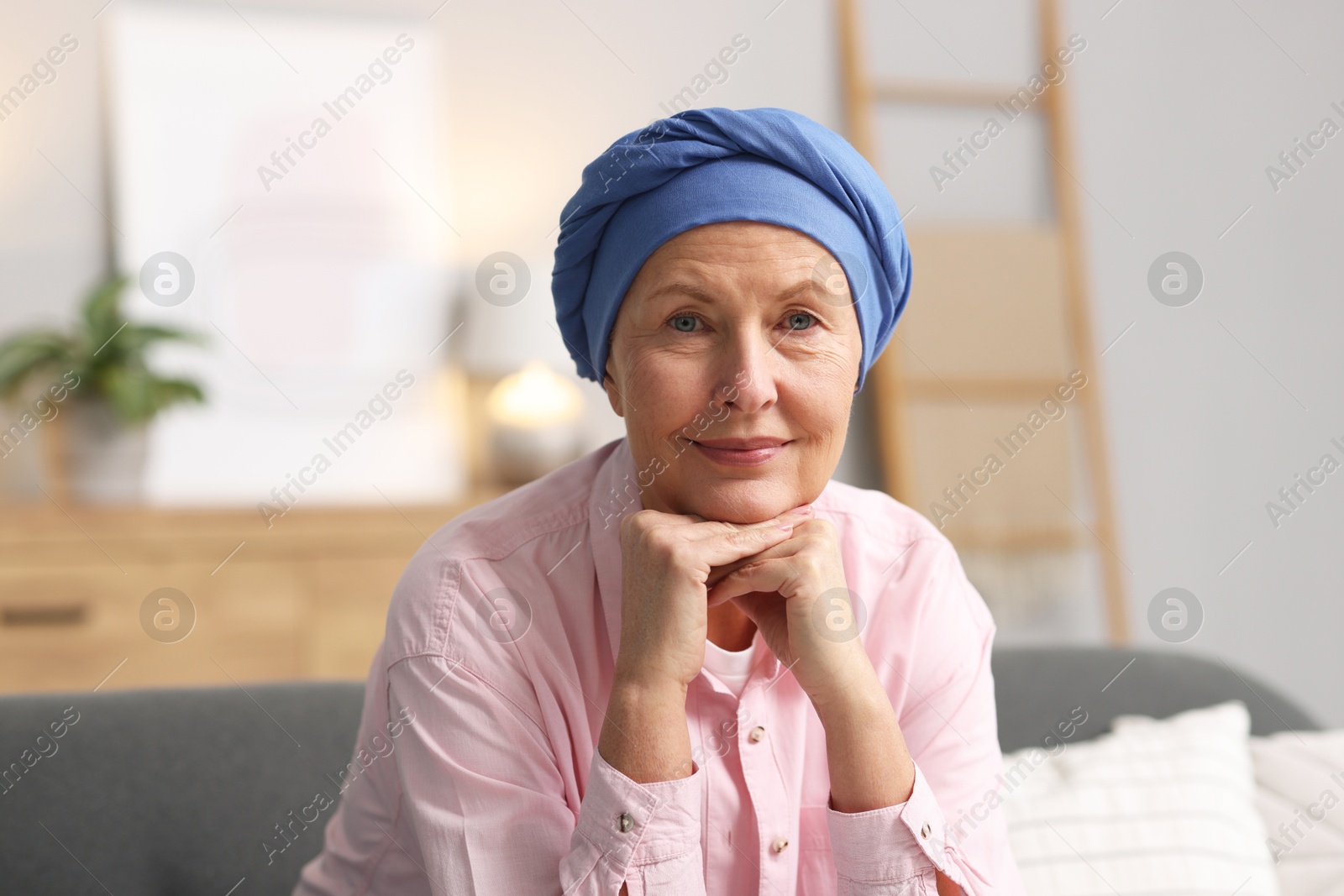 Photo of Senior woman with cancer on sofa at home