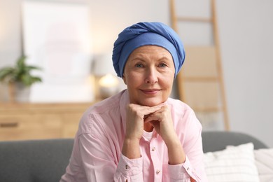 Photo of Senior woman with cancer on sofa at home