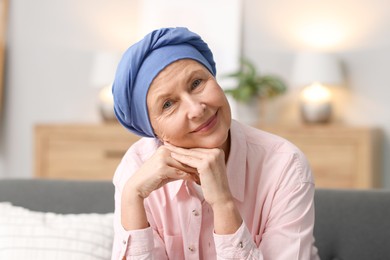 Photo of Senior woman with cancer on sofa at home