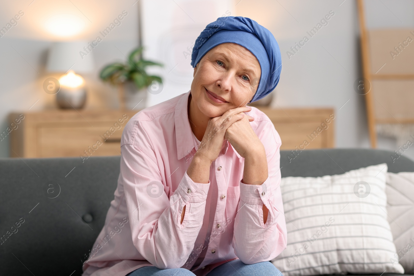 Photo of Senior woman with cancer on sofa at home