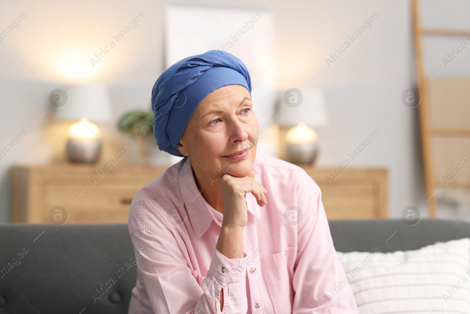 Photo of Senior woman with cancer on sofa at home