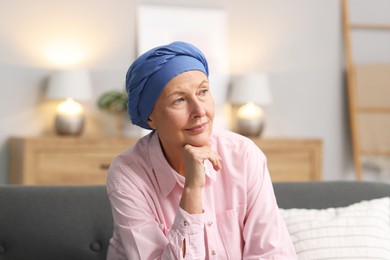 Photo of Senior woman with cancer on sofa at home