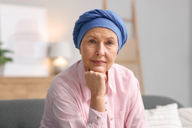 Photo of Senior woman with cancer on sofa at home