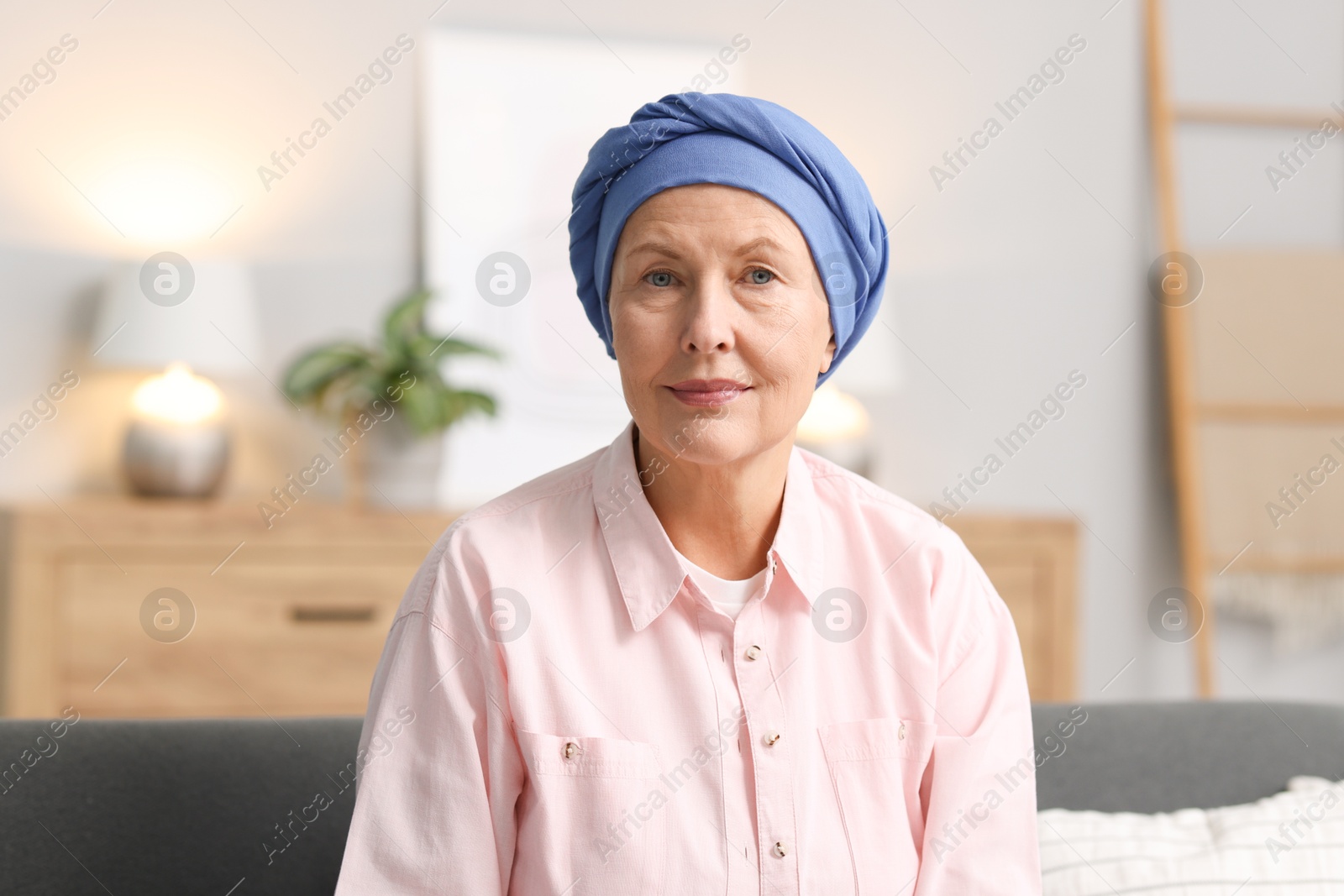 Photo of Senior woman with cancer on sofa at home