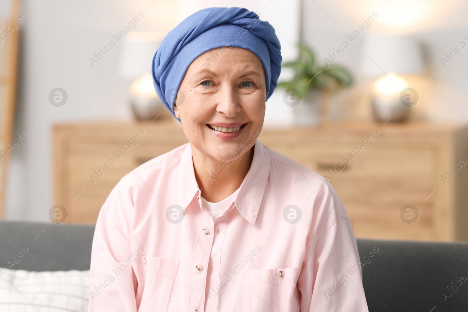 Photo of Senior woman with cancer on sofa at home