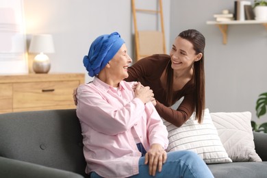 Photo of Woman with cancer and her daughter at home