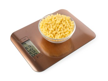 Photo of Electronic kitchen scale with bowl of raw pasta isolated on white