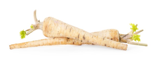 Photo of Fresh parsnips isolated on white. Root vegetable