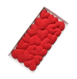 Chocolate bar decorated with hearts in box isolated on white, top view