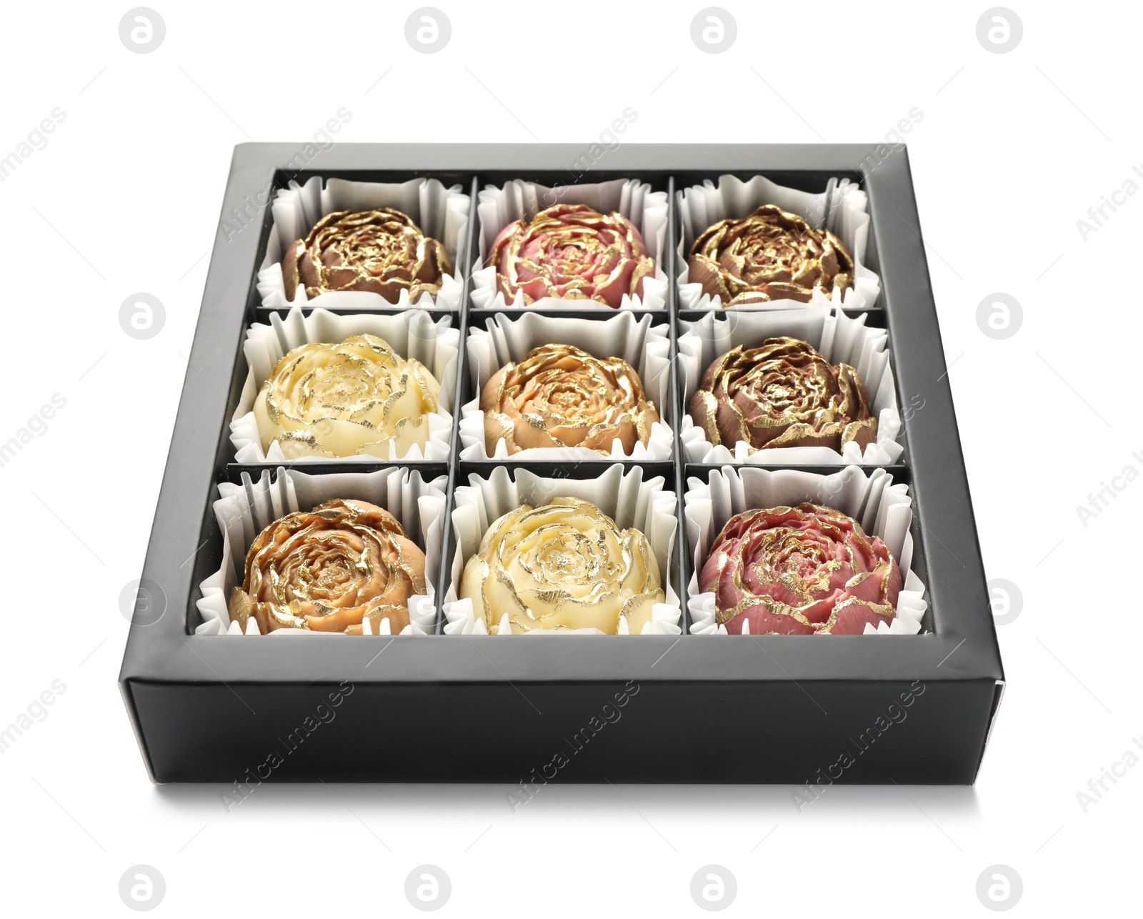 Photo of Flower shaped chocolate bonbons in box isolated on white