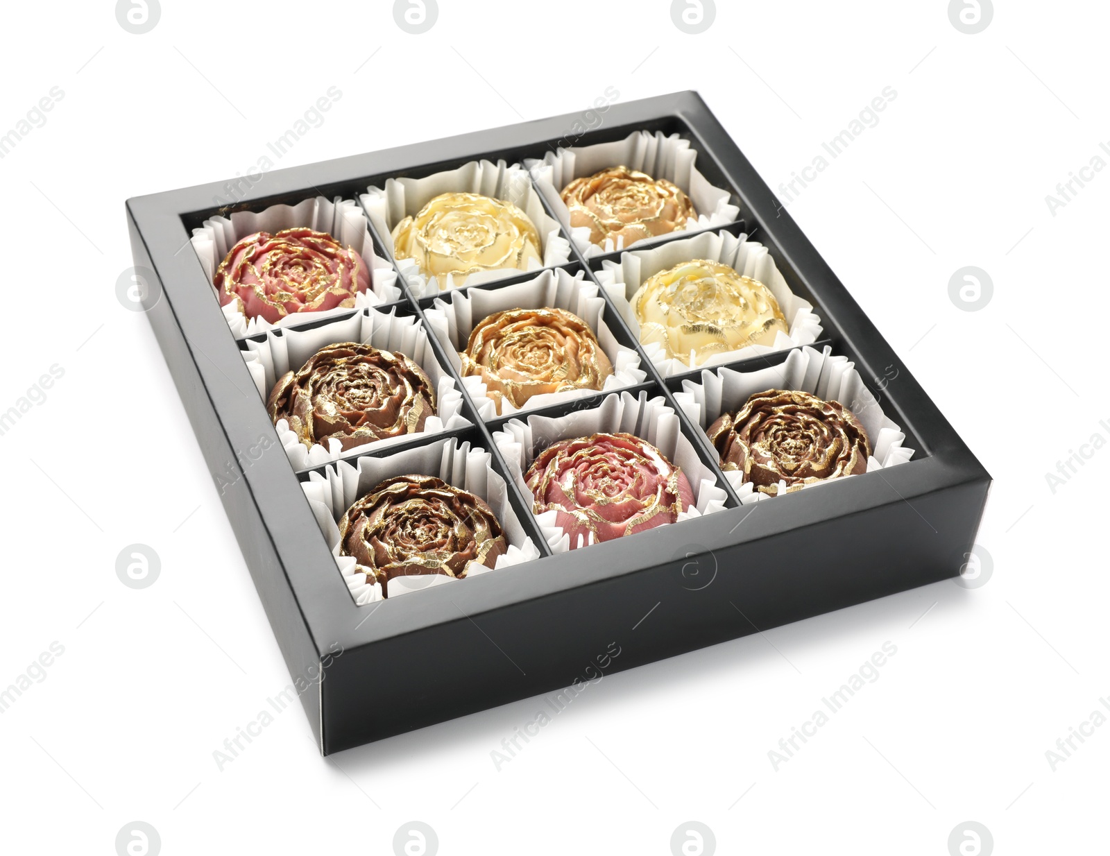 Photo of Flower shaped chocolate bonbons in box isolated on white