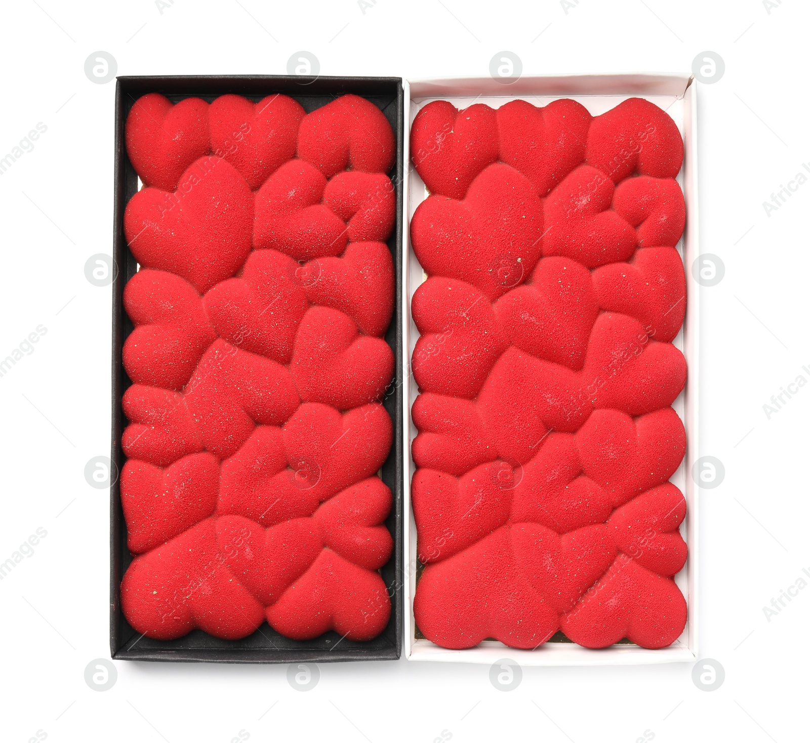 Photo of Chocolate bars decorated with hearts in boxes isolated on white, top view