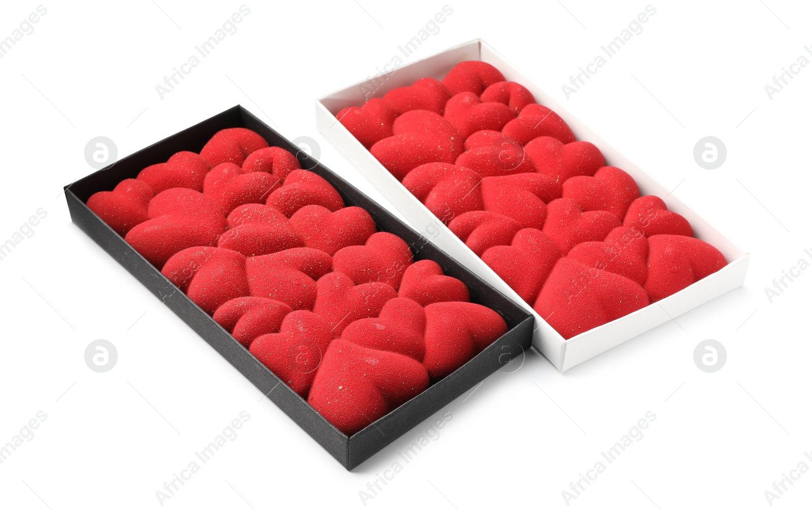 Photo of Chocolate bars decorated with hearts in boxes isolated on white