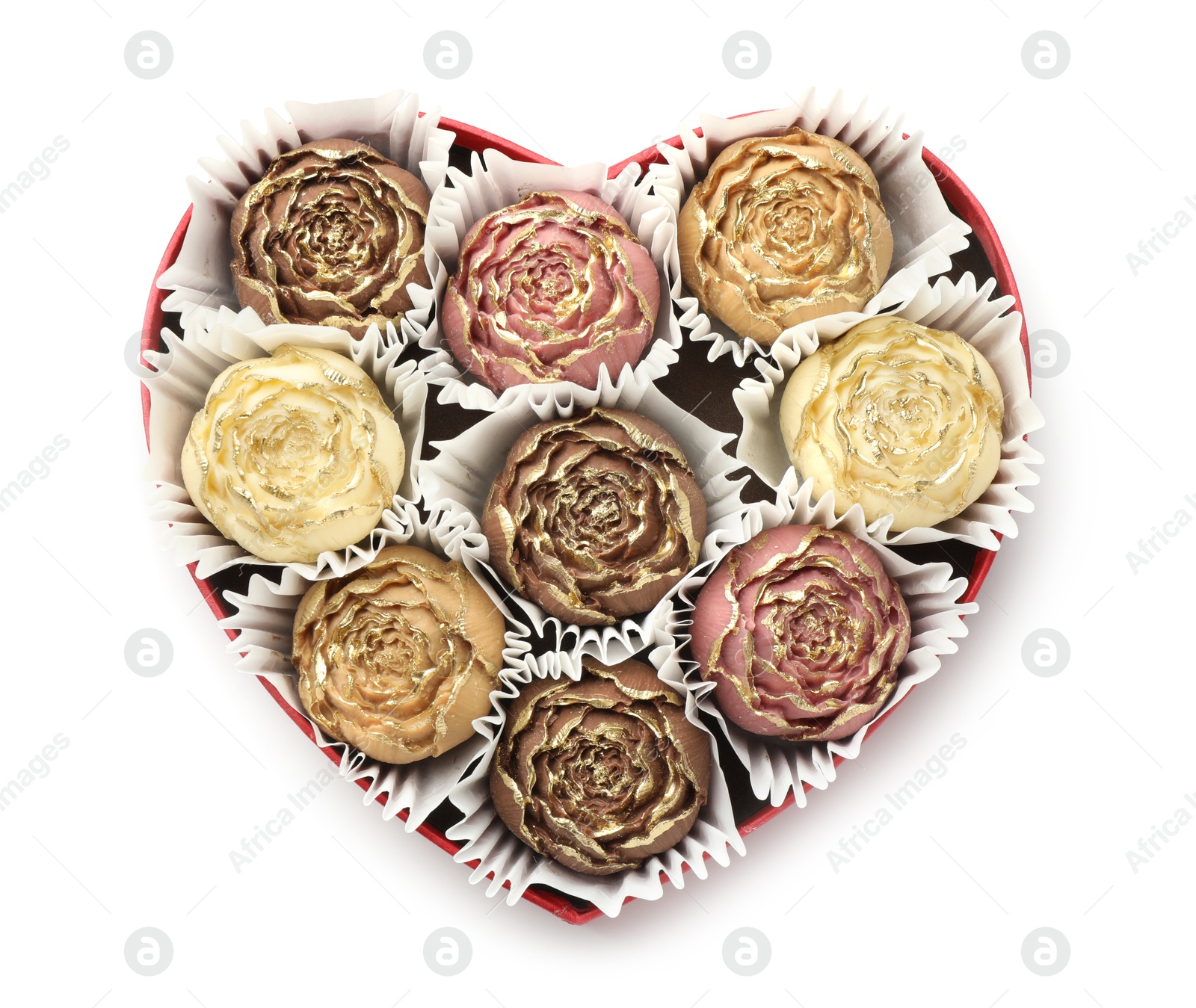 Photo of Flower shaped chocolate bonbons in box isolated on white, top view