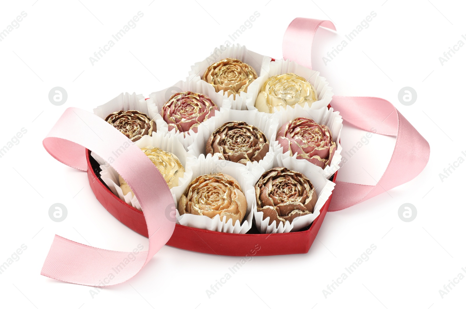 Photo of Flower shaped chocolate bonbons in box and pink ribbon isolated on white