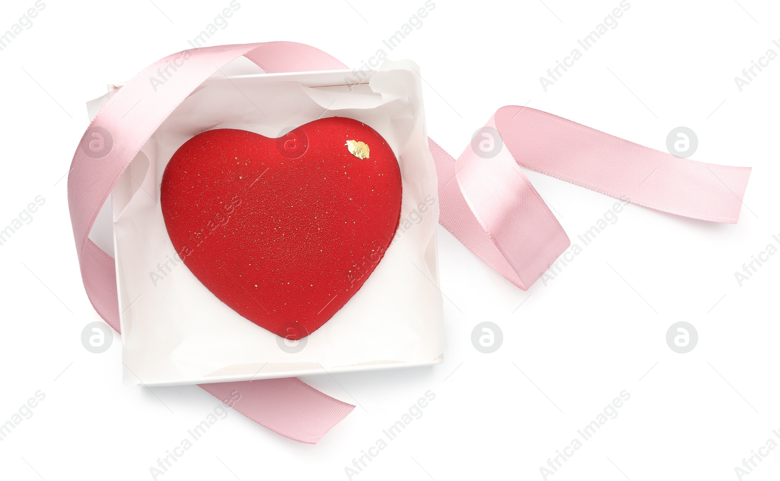 Photo of Heart shaped chocolate in box and pink ribbon isolated on white, top view