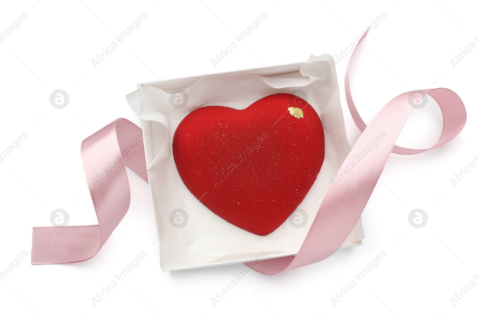 Photo of Heart shaped chocolate in box and pink ribbon isolated on white, top view