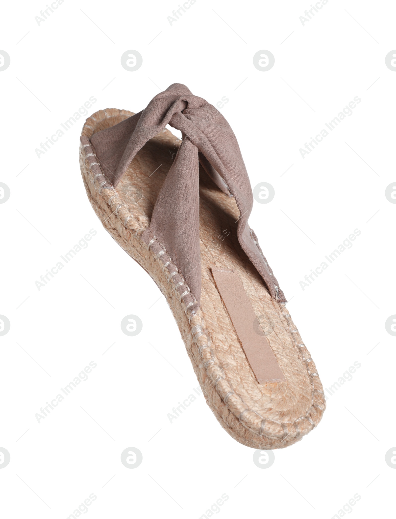 Photo of One stylish slipper in air isolated on white