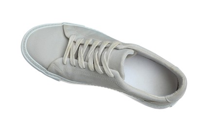 Photo of One grey sneaker in air isolated on white