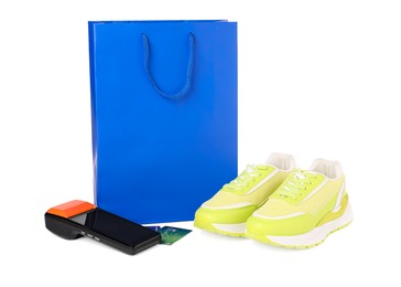 Photo of Payment terminal, shopping bag and sneakers isolated on white