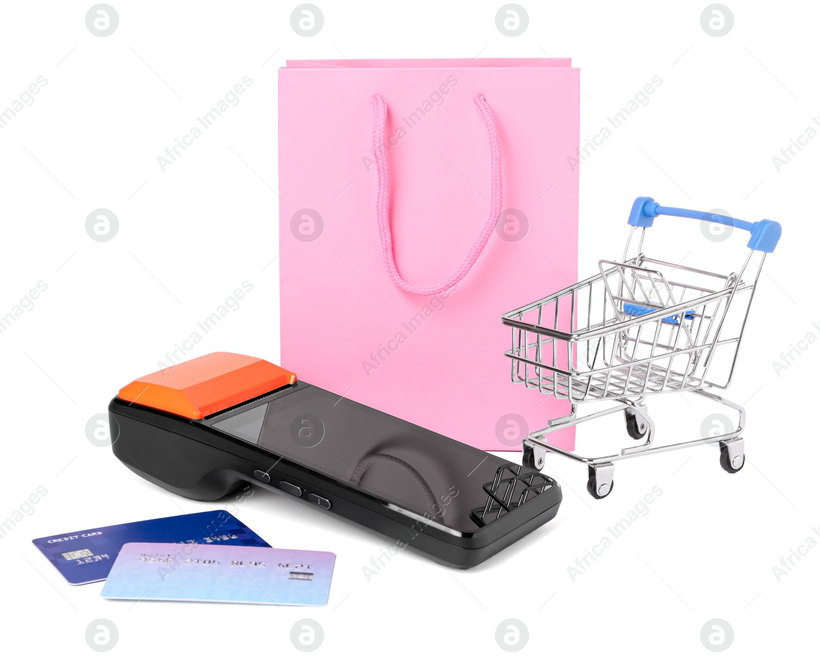 Photo of Payment terminal, shopping bag, credit cards and mini cart isolated on white