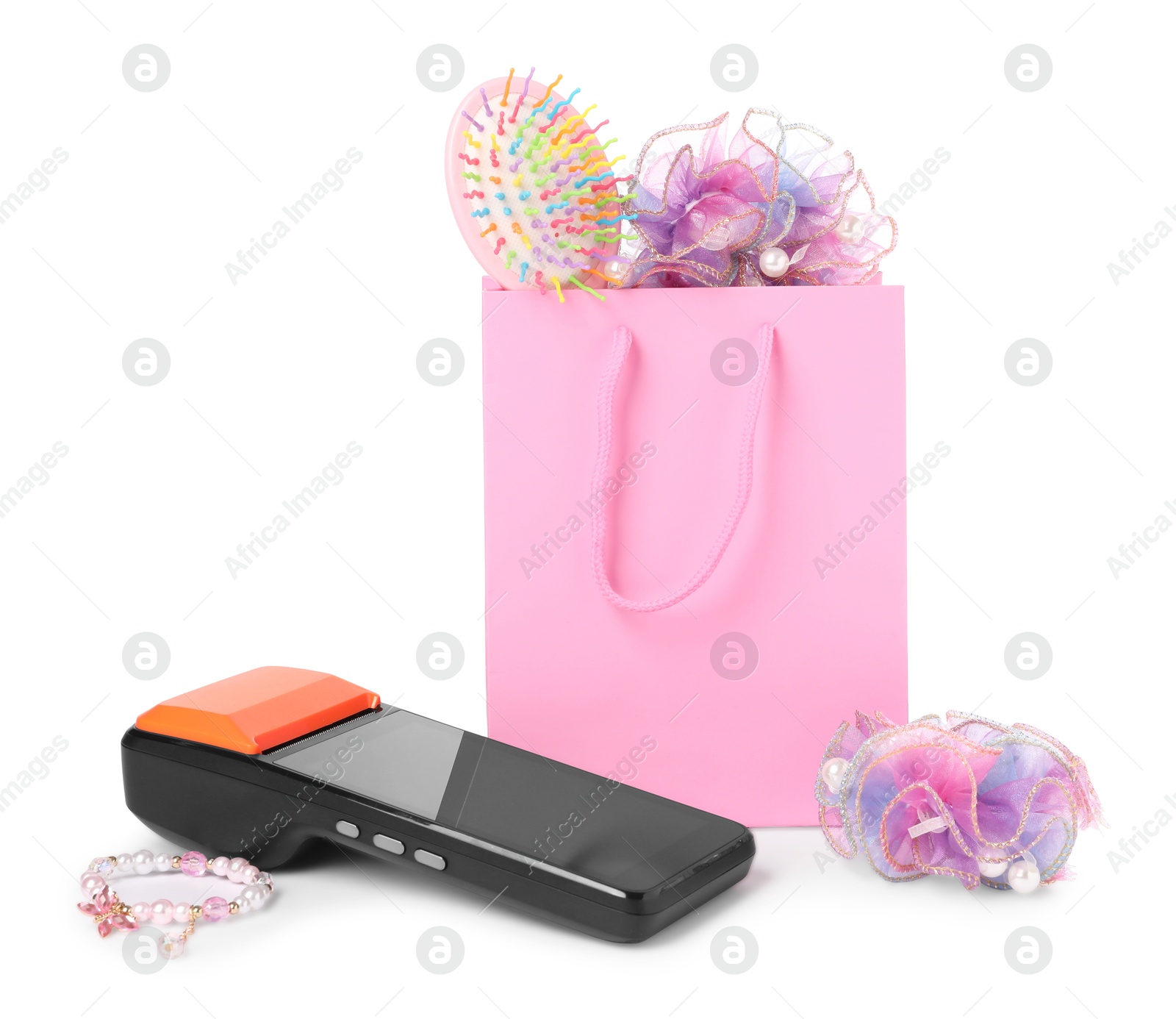 Payment terminal, shopping bag with child hair accessories isolated on white Photo of Payment terminal, shopping bag with child hair accessories isolated on white