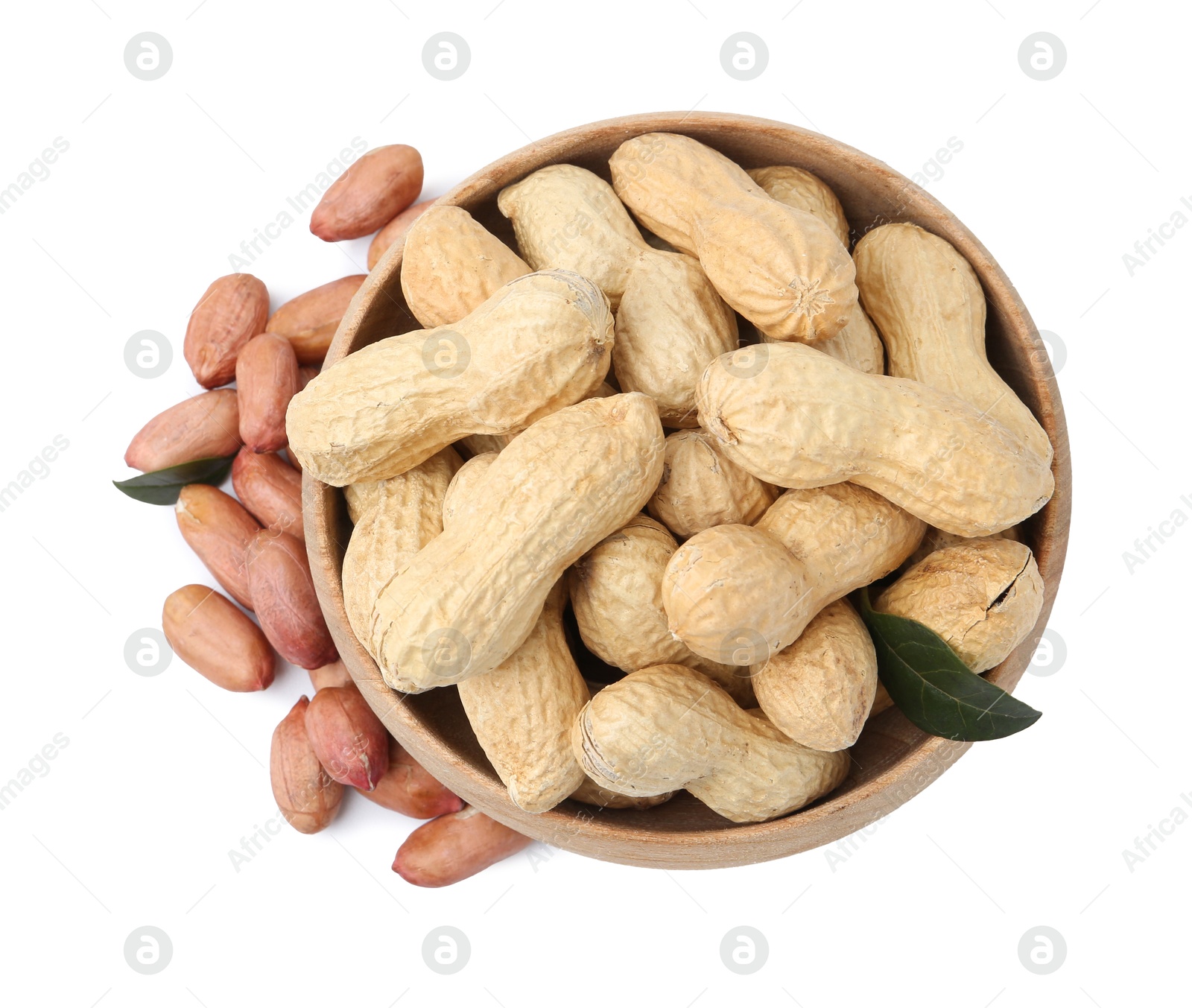 Fresh peanuts and bowl isolated on white, top view Photo of Fresh peanuts and bowl isolated on white, top view
