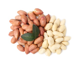 Photo of Pile of fresh peanuts and leaves isolated on white, top view