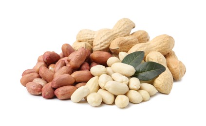 Photo of Pile of different peanuts and leaves isolated on white