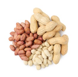 Photo of Pile of different peanuts isolated on white, top view