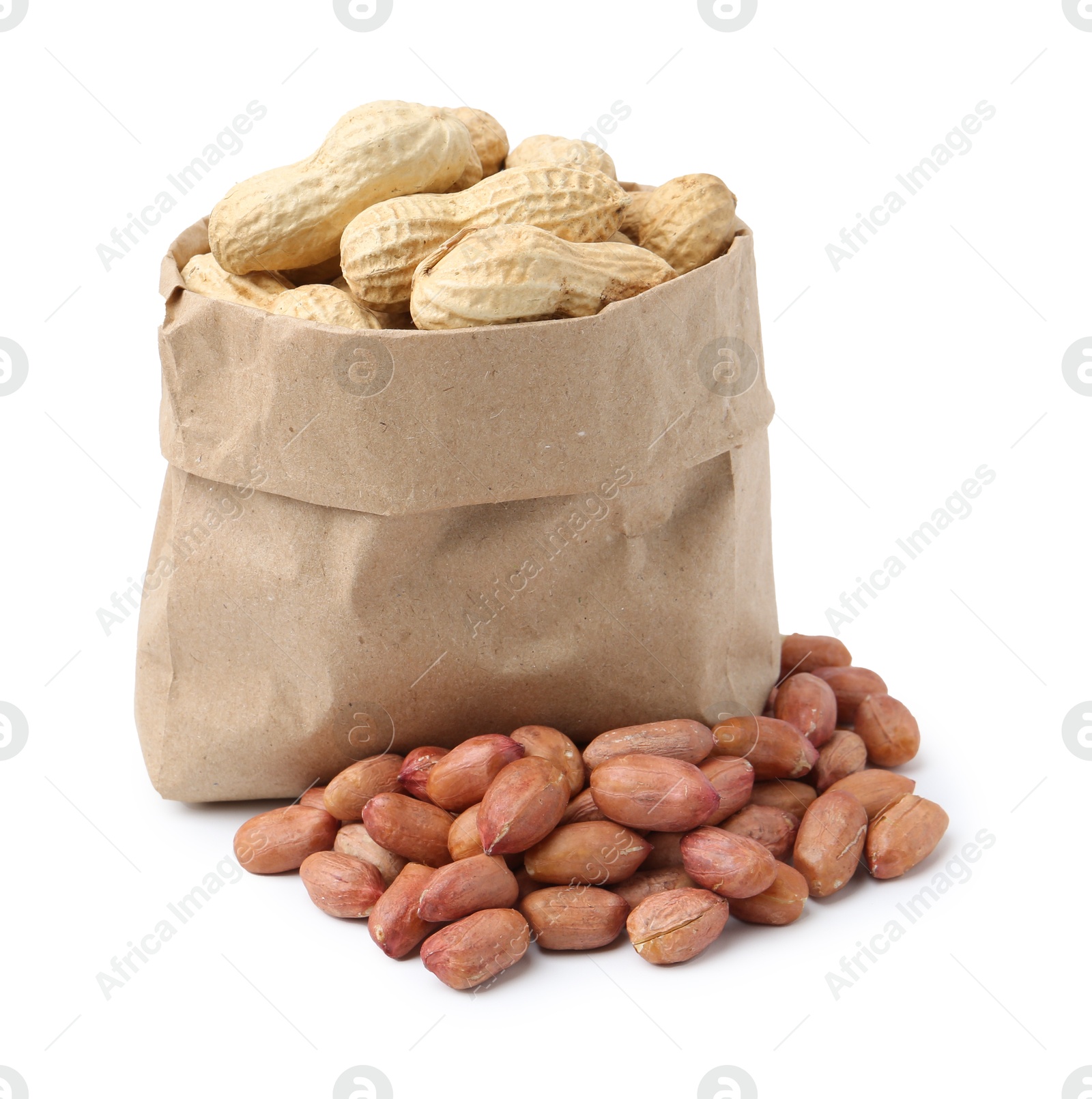 Photo of Fresh peanuts and paper bag isolated on white