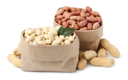 Photo of Different peanuts in paper bags isolated on white