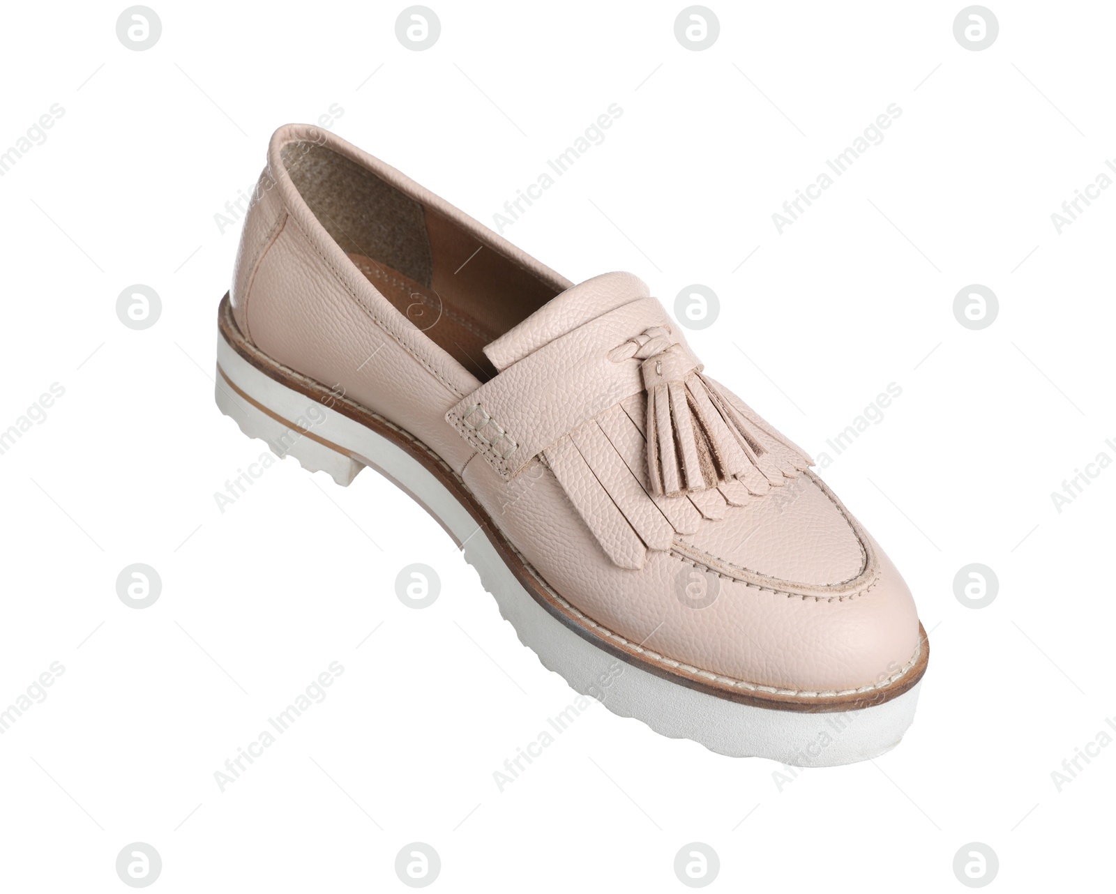 Photo of One beige shoe in air isolated on white